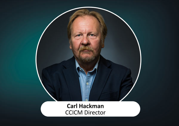 An image of the CCICM Director, Carl Hackman. The background is a dark blue with a circled image of Carl Hackman.