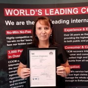 Office & HR Manager Rebecca Davies with ISO9001 certificate.