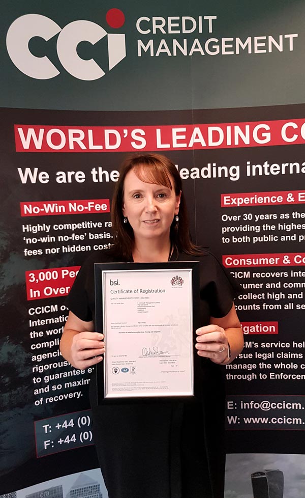 Office & HR Manager Rebecca Davies with ISO9001 certificate.