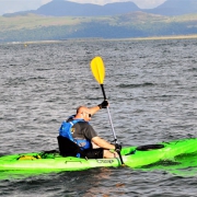 Tom enjoying his maiden kayak ‘sea trials’ voyage near head office off the Snowdonia coast